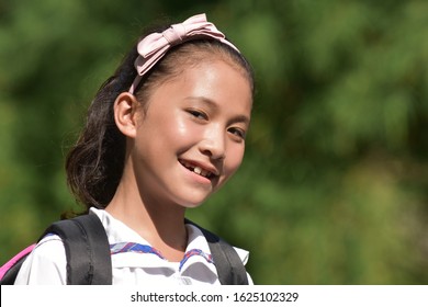A Smiling Young Diverse Female Student