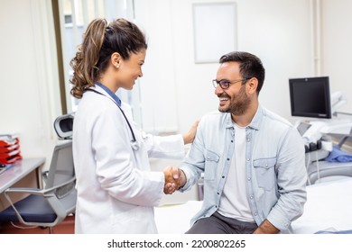 Smiling young female doctor shake hand close health insurance deal with elderly patient at consultation in hospital. Happy woman GP handshake greeting get acquainted with man in clinic. - Shutterstock ID 2200802265