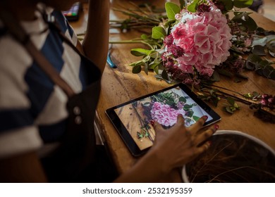 Smiling young female florist preparing bouquet in flower store - Powered by Shutterstock