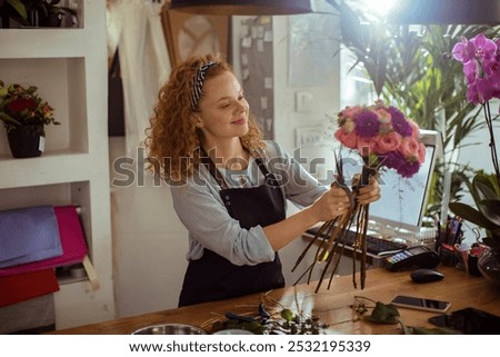 Similar – Image, Stock Photo Woman prepares a bouquet of red roses