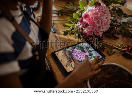 Similar – Image, Stock Photo Woman prepares a bouquet of red roses