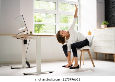 Smiling Young Female Manager Sitting On Chair Stretching Her Arms - Powered by Shutterstock