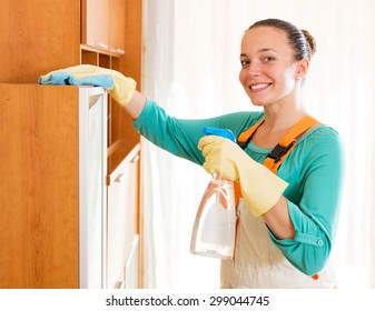 Smiling Young Female Professional Cleaner Cleaning Office Room  