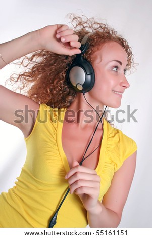 Similar – Young blonde woman listening to music with her headphones