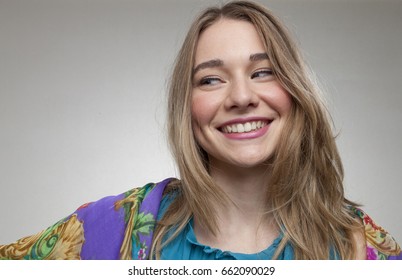 Smiling Young Girl Looking To The Right