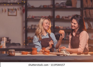 Smiling young girls in a master class in pottery - Powered by Shutterstock