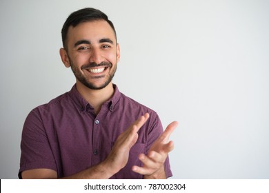 Smiling Young Handsome Man Clapping Hands