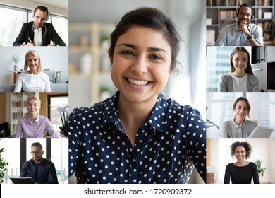 Smiling young indian female employee talk speak on video call with diverse colleagues, multiracial coworkers employees have webcam conference using modern app, engaged in web online briefing
