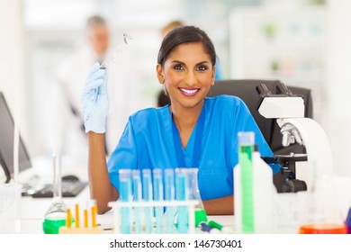 Smiling Young Indian Scientist Portrait In Lab