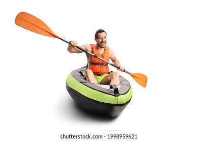 Smiling young man in a canoe with a life vest and a paddle isolated on white background