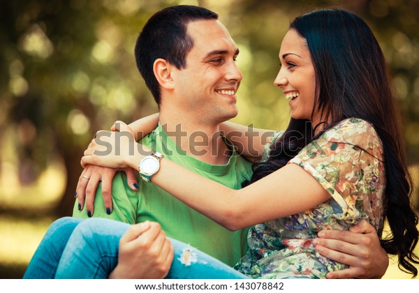 Smiling Young Man Carrying Her Girlfriend Stock Photo (Edit Now) 143078842