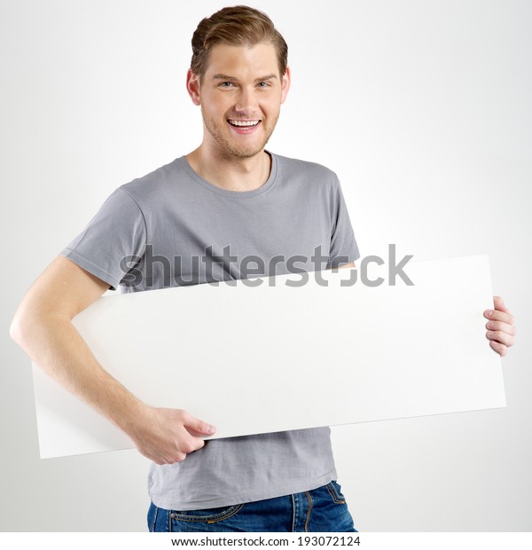 Smiling Young Man Holding Blank Sign Stock Photo 193072124 | Shutterstock