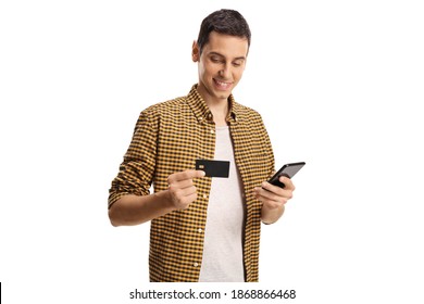 Smiling Young Man With A Mobile Phone And Credit Card Isolated On White Background