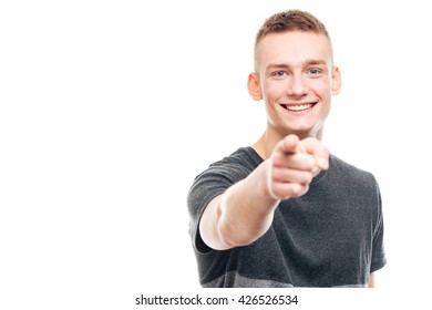 Smiling Young Man Pointing Finger At Camera Isolated On A White Background