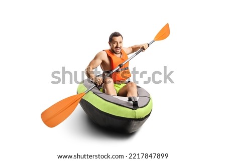 Smiling young man riding a canoe with a life vest isolated on white background