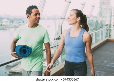 Smiling young man and woman walking after sports - Powered by Shutterstock