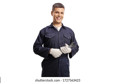 Smiling young mechanic holding a wrench isolated on white background - Powered by Shutterstock