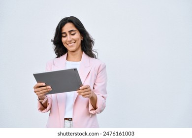 Smiling young middle eastern Israel businesswoman using tablet pc online application for work isolated on white background. Indian or arabic woman in business suit holding digital computer. Copy space