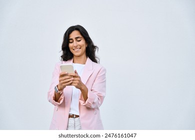 Smiling young middle eastern Israel businesswoman using smartphone mobile phone online app for work isolated on white background. Indian or arabic woman in business suit holding cellphone. Copy space - Powered by Shutterstock