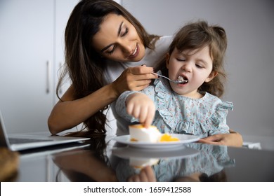 mother feeding child