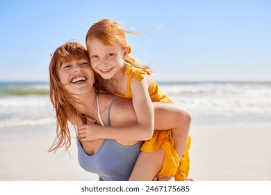 Smiling young mother and beautiful daughter having fun at the beach, both with freckles. Portrait of happy woman with red hair giving a piggyback ride to her cute little girl while looking at camera. - Powered by Shutterstock