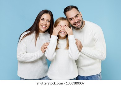 Smiling Young Parents Mom Dad With Child Kid Daughter Teen Girl In Casual White Sweaters Covering Eyes With Hands Isolated On Blue Background Studio Portrait. Family Day Parenthood Childhood Concept