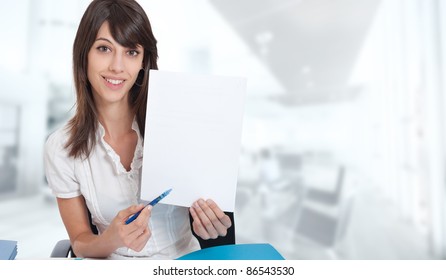 Smiling young woman with customable document in a working environment