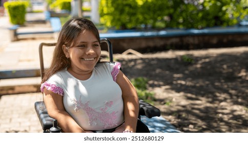 Smiling young woman in electric wheelchair enjoying a sunny day - Powered by Shutterstock