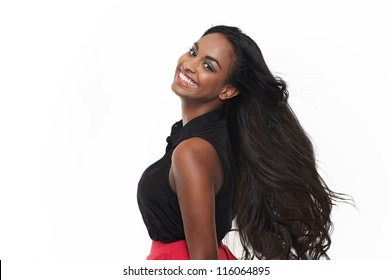 Smiling young woman with flowing hair isolated on white background