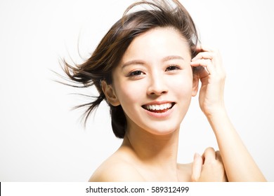 smiling  young Woman with hair motion - Powered by Shutterstock