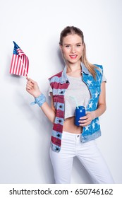 Smiling Young Woman Holding Small American Flag And Can With Straw, Woman Celebrating  Independence Day Of America