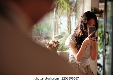 Smiling Young Woman In Love Secretly Photographing Her Crush In Coffeeshop