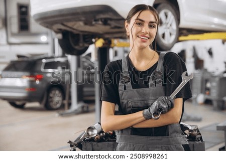 Similar – Image, Stock Photo Mechanic woman standing on motorcycle factory