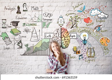 Smiling young woman on brick wall background with abstract brain sketch. Left and right hemispheres concept 