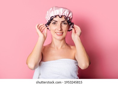 Smiling Young Woman In Pink Shower Cap On Pink Background