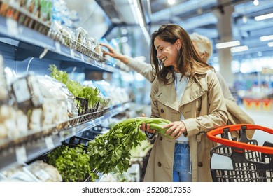 Smiling young woman selects fresh vegetables in a grocery store. Bright and vibrant shopping experience, emphasizing healthy living and fresh produce. - Powered by Shutterstock