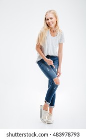 Smiling Young Woman Showing Ripped Pants Isolated On A White Background