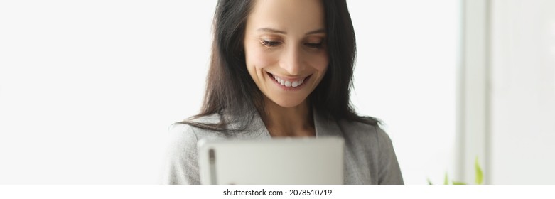 Smiling Young Woman In Suit Holding Digital Tablet. Social Media Communication Concept