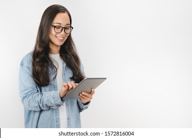 Smiling Young Woman Using Tablet Computer Isolated On White Background