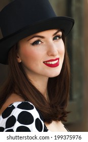 Smiling Young Woman Wearing Top Hat. Toned Image