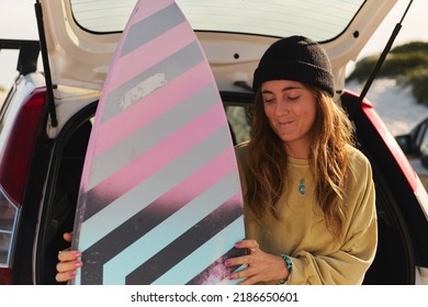 Smiling Young Women Holding Surf Board Packing Packing Car For Adventure Road Trip At The Beach Sunny