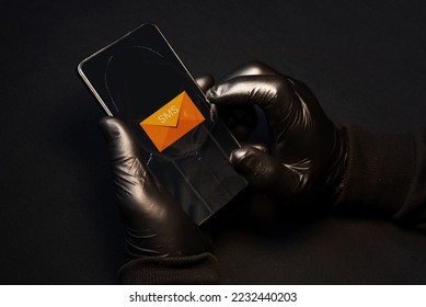 Smishing alert. A cybercriminal sending fraudulent text messages via cell phone to scam vulnerable people. Smishing danger - Shutterstock ID 2232440203