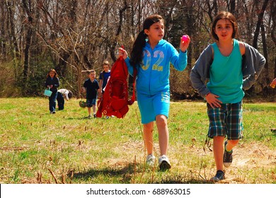 Smithtown, NY, USA April 2 Two Young Girls Enjoy An Easter Egg Hunt At Sweetbriar Preserve In Smithtown, New York