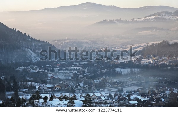 Smog in a mountain valley in winter. Szczawnica\
in Poland.