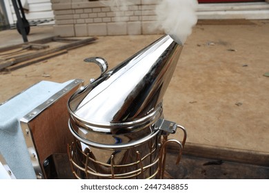 smoke billows beekeeping smoker tool honey bees - Powered by Shutterstock