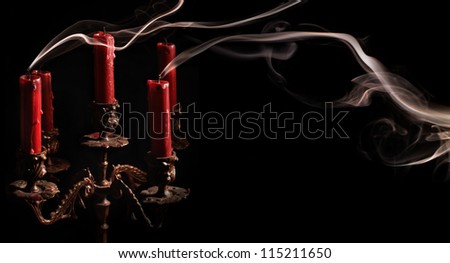 Smoke from blowing candles at the antique candlestick