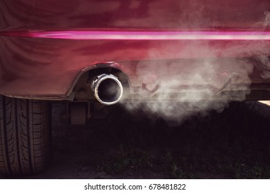 Smoke From Car Pipe Exhaust. Old Dirty Red Car