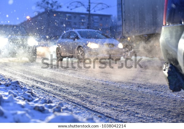 smoke of cars in\
traffic jam of blizzard