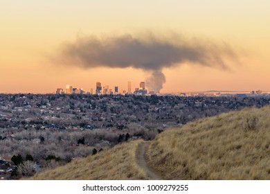 Smoke Cloud Hovering Over Downtown Denver - A thick cloud of black smoke, from a fire at a recycling plant in Denver, hovering over the city's evening skyline, seen from a hilltop in Lakewood. CO, USA