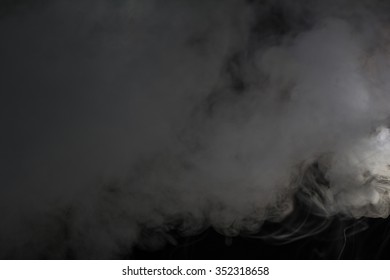 Smoke cloud over black background - Shutterstock ID 352318658